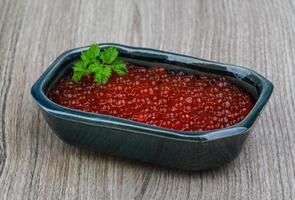 Red caviar on wood photo