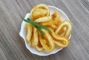 Squid rings on wood photo