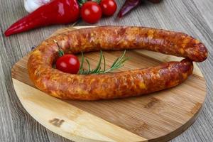 Sausage ring on wood photo