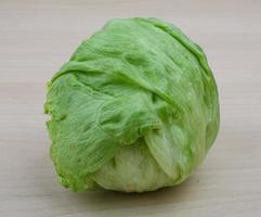 Iceberg salad on wood photo