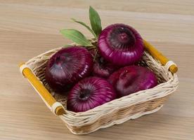 Violet onion on wood photo