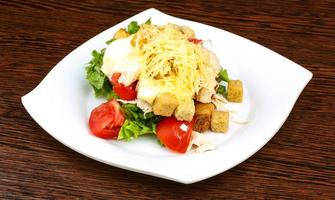 Caesar salad on plate photo