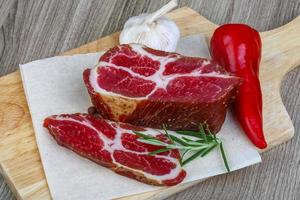 Chuck steak on wood photo