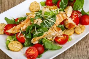 Caesar salad on wood photo