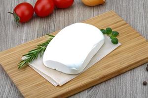 Feta cheese on wood photo