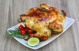 Grilled chicken on wood photo