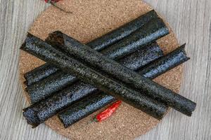 Seaweed rolls on wood photo