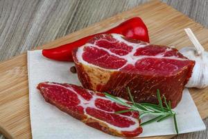 Chuck steak on wood photo