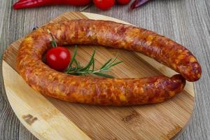 Sausage ring on wood photo