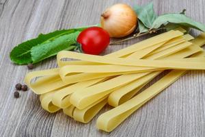 Fettuccine on wood photo