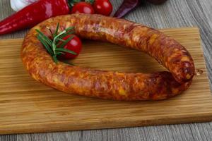 Sausage ring on wood photo