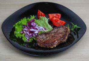 Beefsteak on plate photo