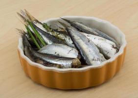 Salted anchovy on wood photo