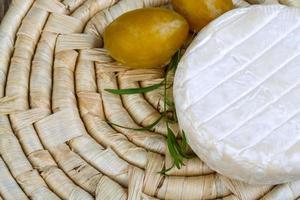 Brie cheese on wood photo