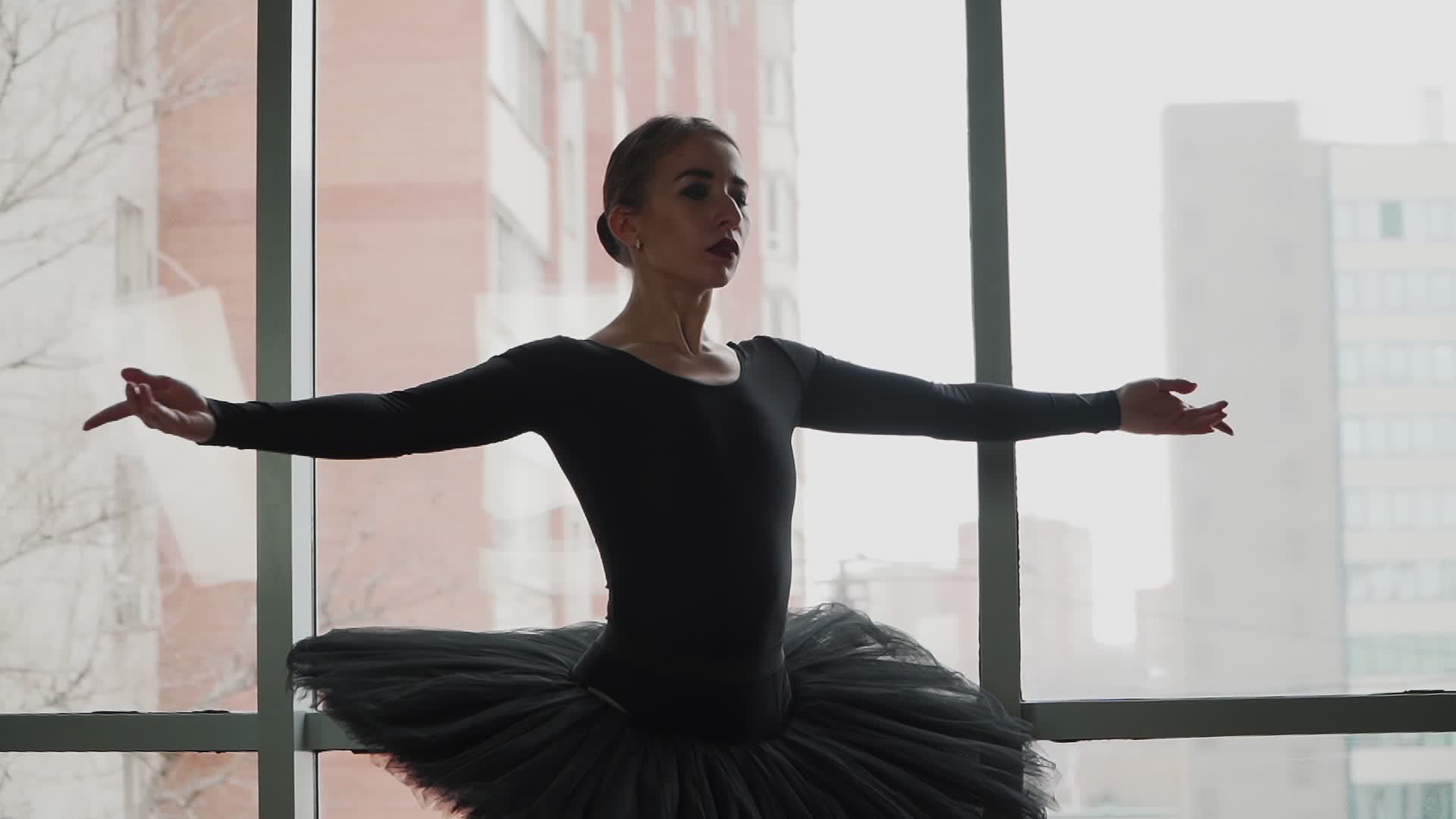 ballerina on a background of the city a beautifully moving dance. In a
