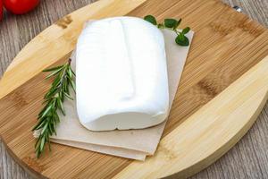 Feta cheese on wood photo