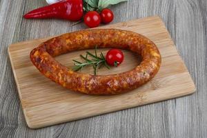 Sausage ring on wood photo