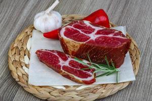 Chuck steak on wood photo