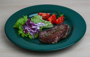 Beefsteak on plate photo