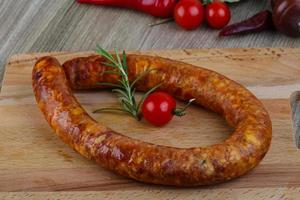 Sausage ring on wood photo