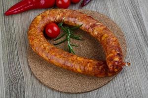 Sausage ring on wood photo