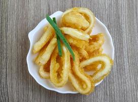 Squid rings on wood photo