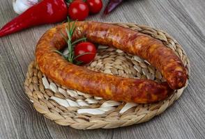 Sausage ring on wood photo