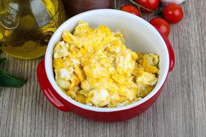 Scrambled eggs on wood photo