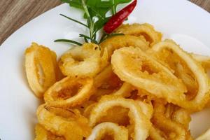 Squid rings on wood photo