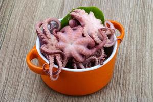 Marinated octopus on wood photo