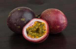 Passion fruit on black background photo