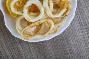 Squid calamari on wood photo