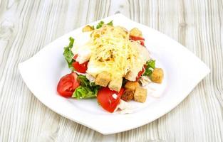 Caesar salad on plate photo