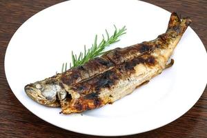 Grilled trout on wood photo