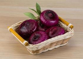 Violet onion on wood photo