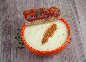Cheese soup on wood photo