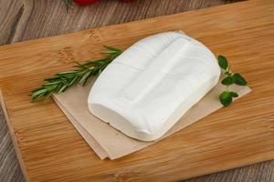 Feta cheese on wood photo