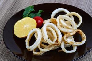 Squid calamari on wood photo