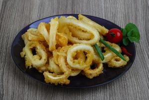 Squid rings on wood photo