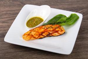 Grilled salmon on wood photo