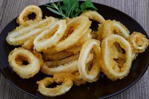 Squid rings on wood photo