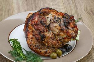 Pork knee on wood photo