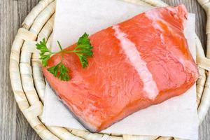 Salmon fillet on wood photo