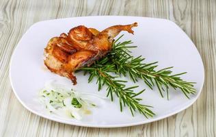 Grilled quail on wood photo