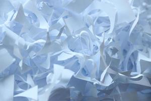 Shredded paper texture background, top view of many white paper strips. Pile of cut paper like box filler for shipping fragile items photo