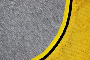 Top view of cloth textile surface. Close-up rumpled heater and knitted fabric texture with a thin striped pattern. Sport clothing fabric texture. Colored basketball shirt and heater hoodie photo