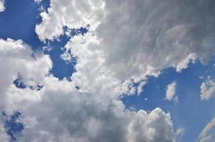 Beautiful blue sky background template with some space for input text message below isolated on blue photo