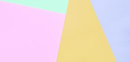 Texture background of fashion pastel colors. Pink, violet, orange and blue geometric pattern papers. photo