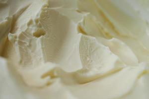 close up of fresh butter in a container photo