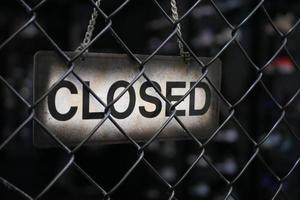 closed sign hanging on door of cafe. photo